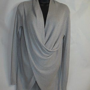 Jennifer Lopez Glimmery Silver low cut mini dress